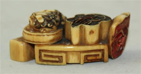 A Japanese ivory multi seal netsuke, 19th century, 5cm